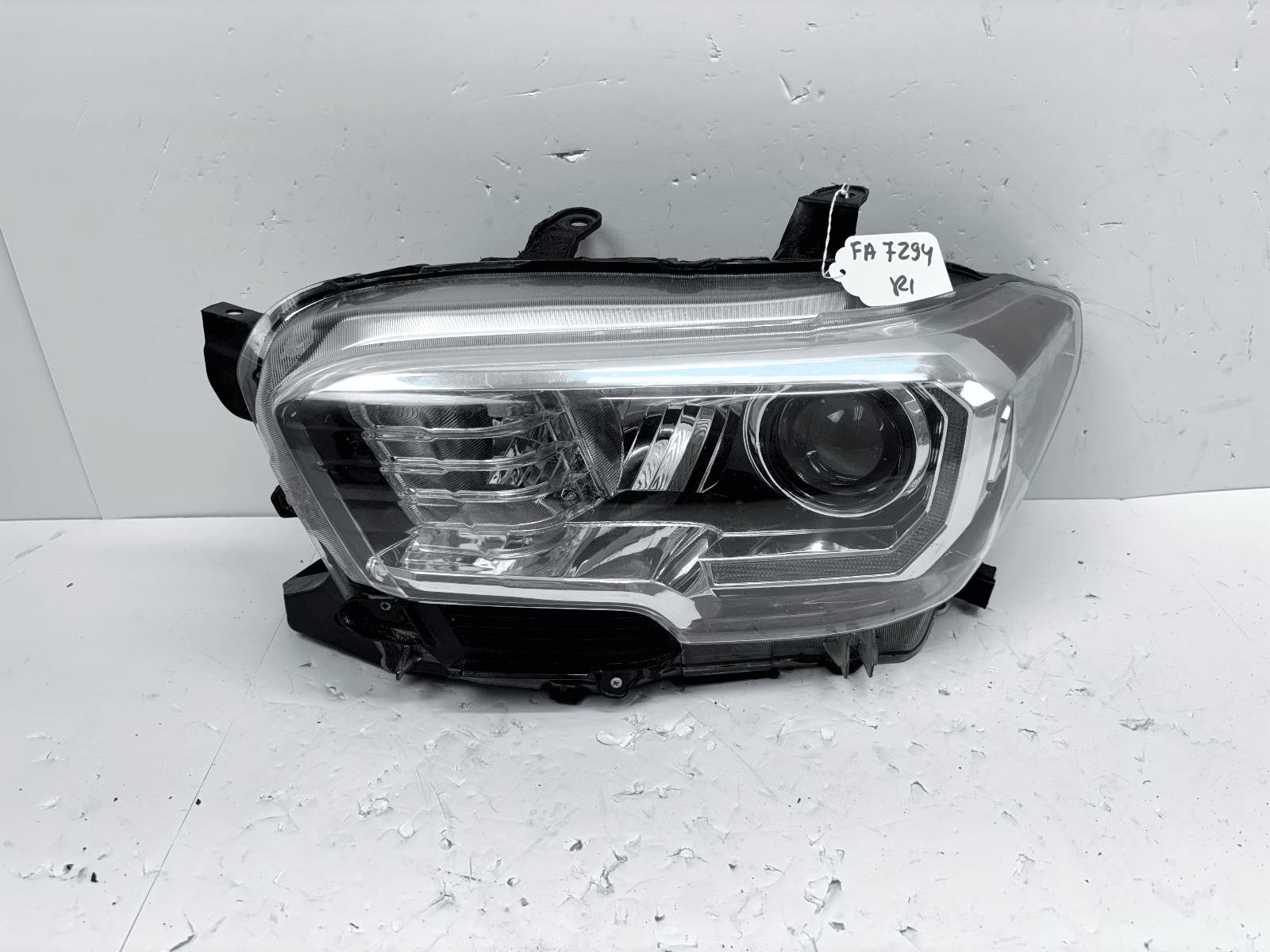 2016-22 Toyota Tacoma Left Front Headlight Halogen CAPA Certified Used